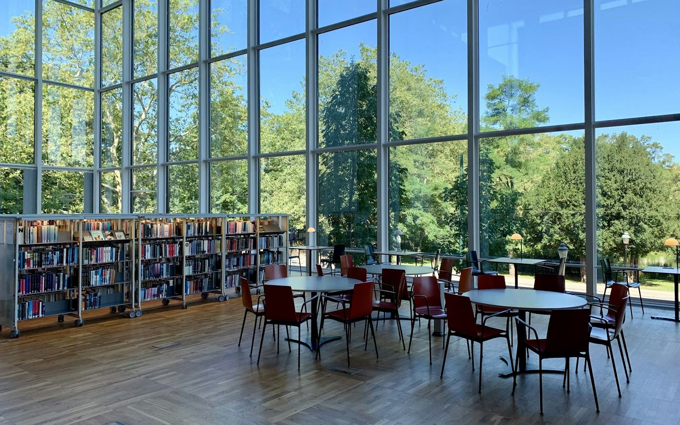 The double-height reading room, with study tables by the garden windows